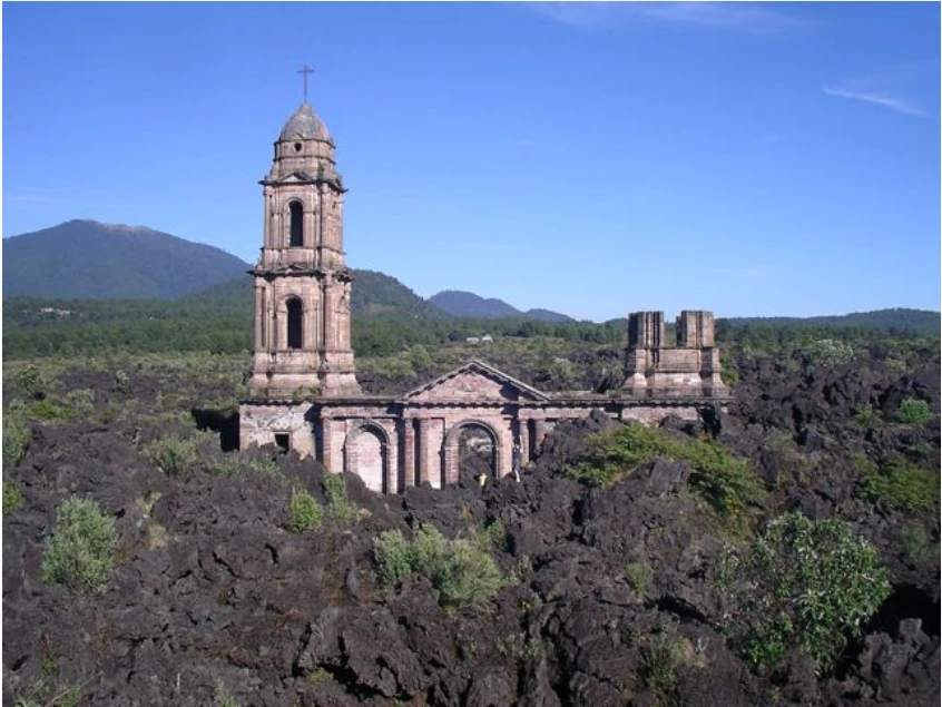 Historic church surrounded by the volcanic landscape of Michoacán